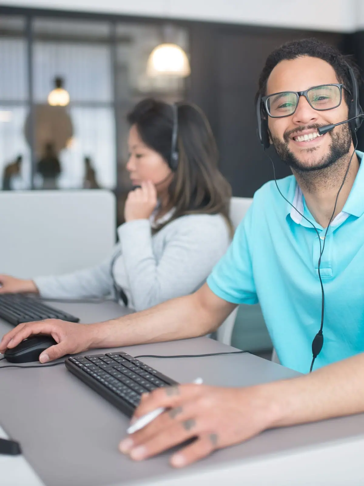 Agent with a headset working at a desk