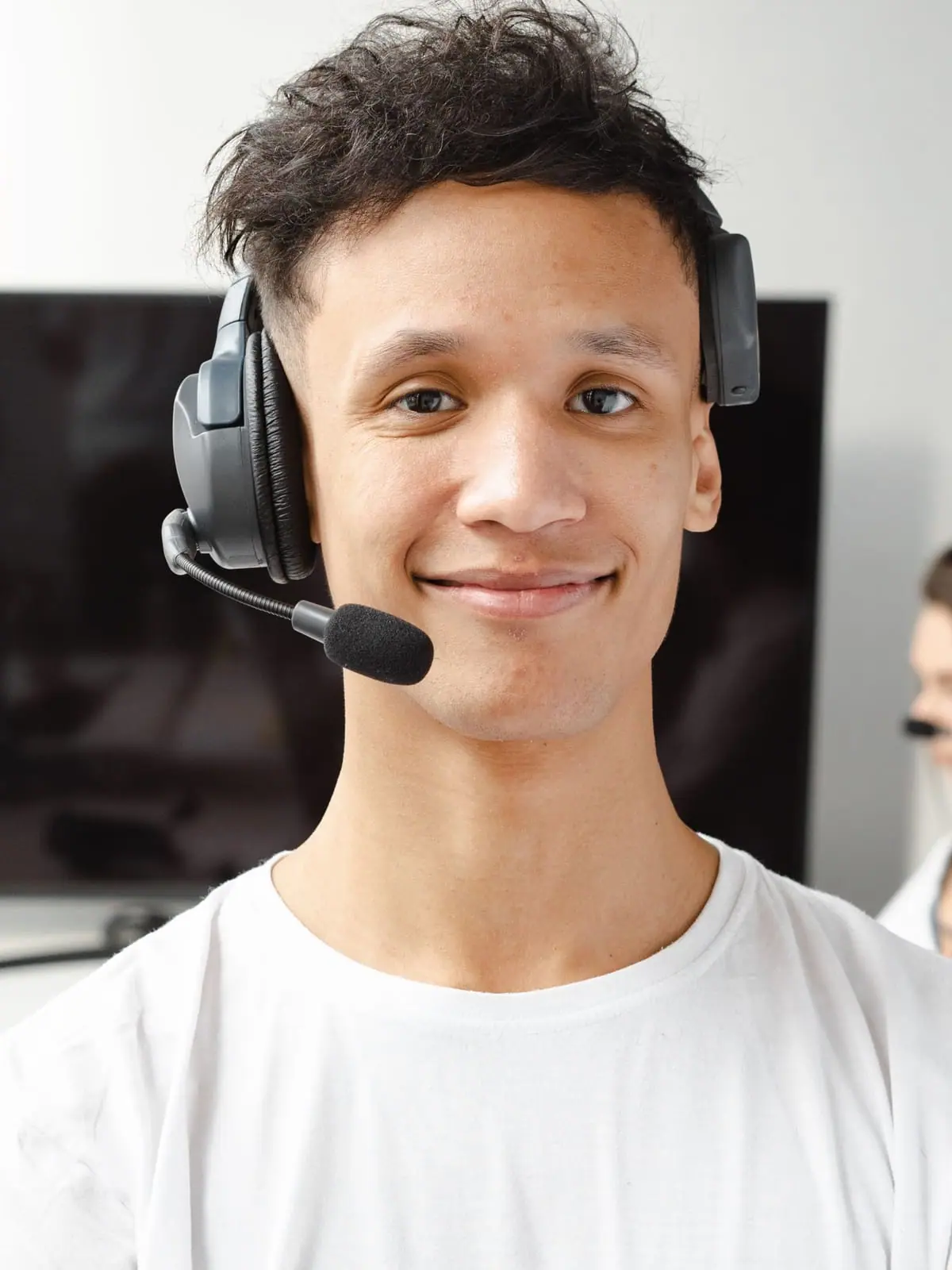Close portrait of an agent wearing a headset and microphone
